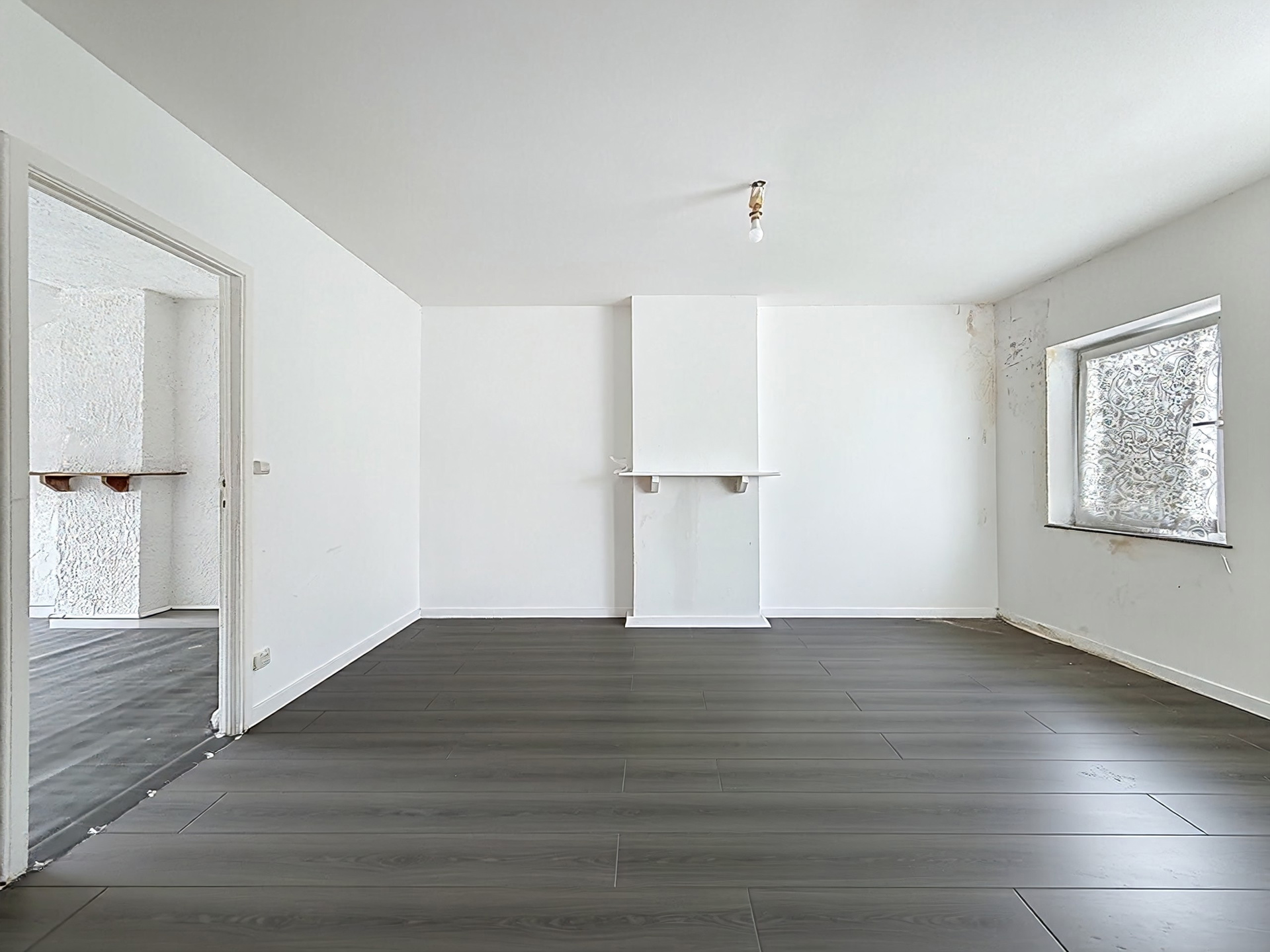 Photo du bien IMMEUBLE MIXTE 3 APPARTS et RDC COMMERCIAL (en ordre d'urbanisme)